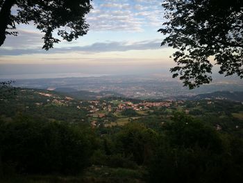 Scenic view of mountains against cloudy sky