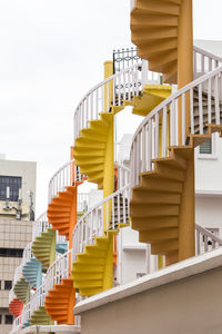 Colorful spiral staircases at the back of traditional chinese shop houses