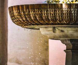 Close-up of fountain against building