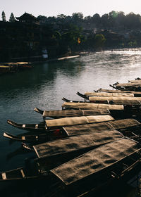 High angle view of gondolas moored in canal on sunny day