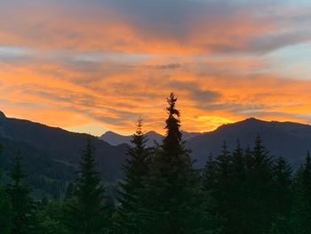 Scenic view of mountains against sky during sunset