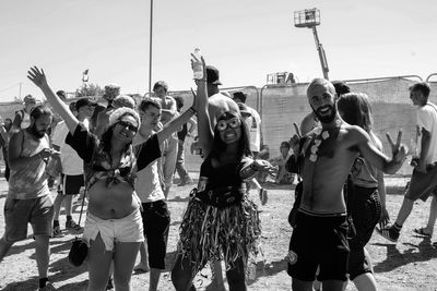 Group of people standing against sky