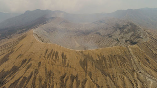 Active volcano bromo with smoking crater. mountain landscape tengger semeru national park.