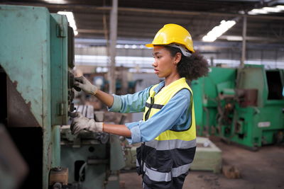 Side view of man working at construction site