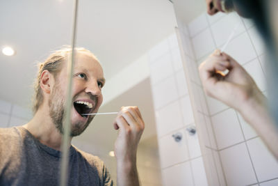 Man using covid-19 swab test