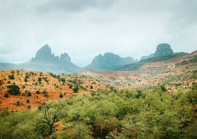 Scenic view of landscape and mountains against sky