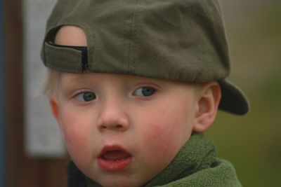 Close-up of cute boy looking away