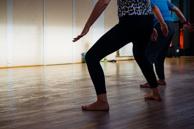 Low section of woman dancing at home