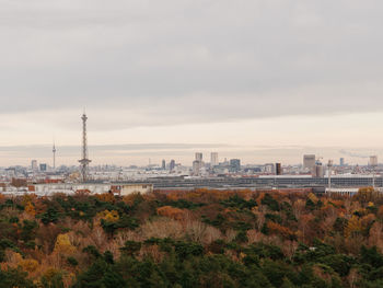 High angle view of trees and buildings against sky