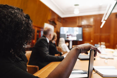 Businesswoman in video conference meeting with colleagues