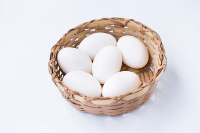 High angle view of eggs in basket