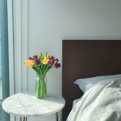 Flower vase on table at home