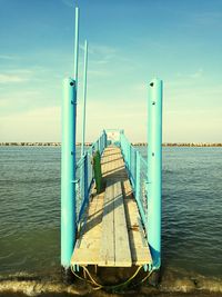 Pier over sea against sky