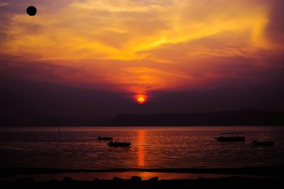 Scenic view of sea against dramatic sky