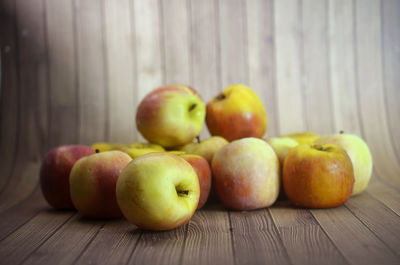 Close-up of apples on wooden table