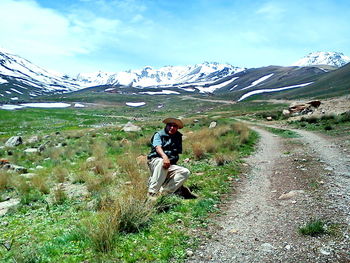 Full length of man on mountain against sky