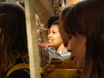 Portrait of happy girl with arms raised