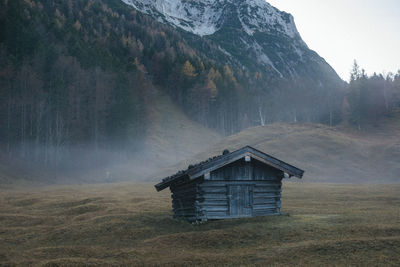 Built structure on landscape against sky