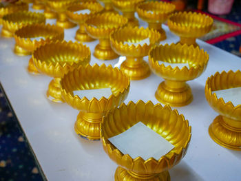 High angle view of yellow decorations on table in building