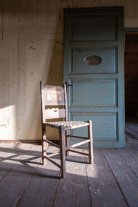 Empty chair in abandoned building