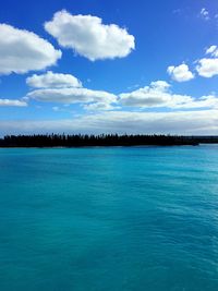 Scenic view of sea against blue sky