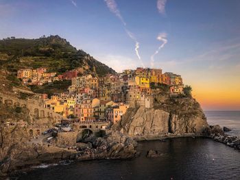 Panoramic view of sea and buildings against sky