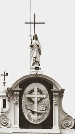 Low angle view of statue against sky