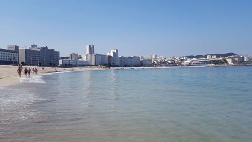 Scenic view of sea against blue sky