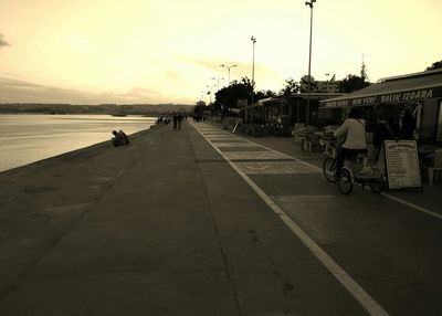 People in water at sunset