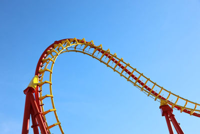 Low angle view of rollercoaster against sky