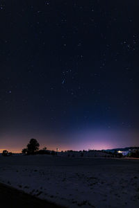 Scenic view of star field against sky at night