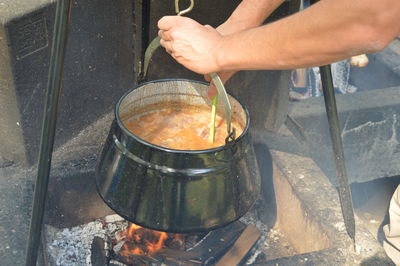 Cropped image of person preparing food