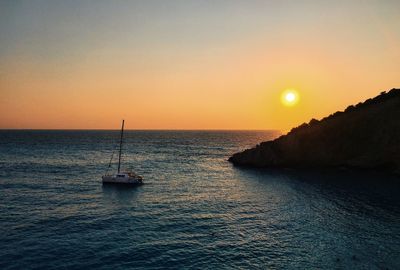 Scenic view of sea against clear sky during sunset