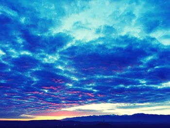Scenic view of dramatic sky over landscape