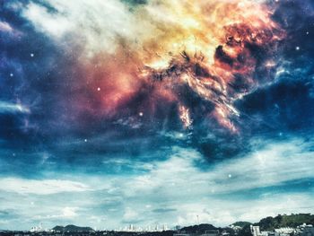 Low angle view of dramatic sky at night