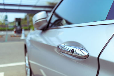 Door handle of modern car, push button to lock vehicle, keyless entry door handle, selective focus