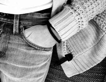 Low section of person wearing canvas shoes
