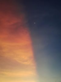 Low angle view of dramatic sky during sunset