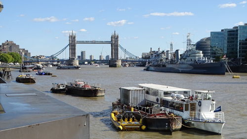 The thames river london, uk - tower bridge, hms belfast, rib thames experience and other watercraft