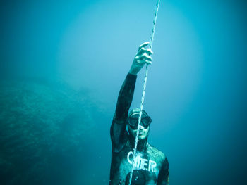 Person swimming in blue sea