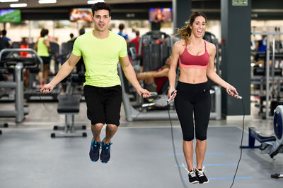 Friends exercising in gym