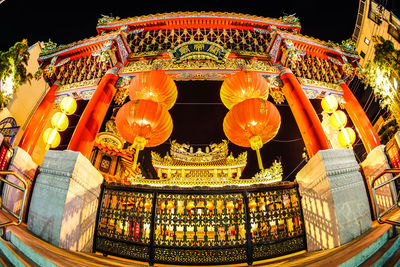 Low angle view of illuminated temple building