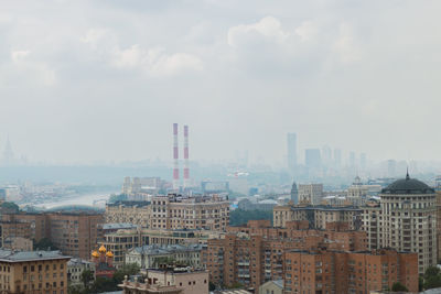 High angle view of buildings in city against sky