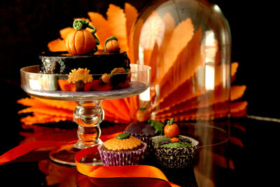 Close-up of lit candles on table