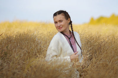 Young woman standing on field