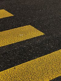 High angle view of yellow markings on road