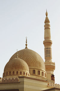 Low angle view of mosque against clear sky