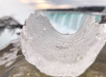 Close-up of ice against sky