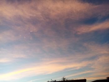 Low angle view of dramatic sky during sunset