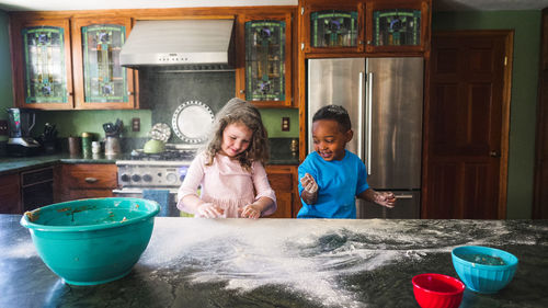 Kids making a mess in the kitchen